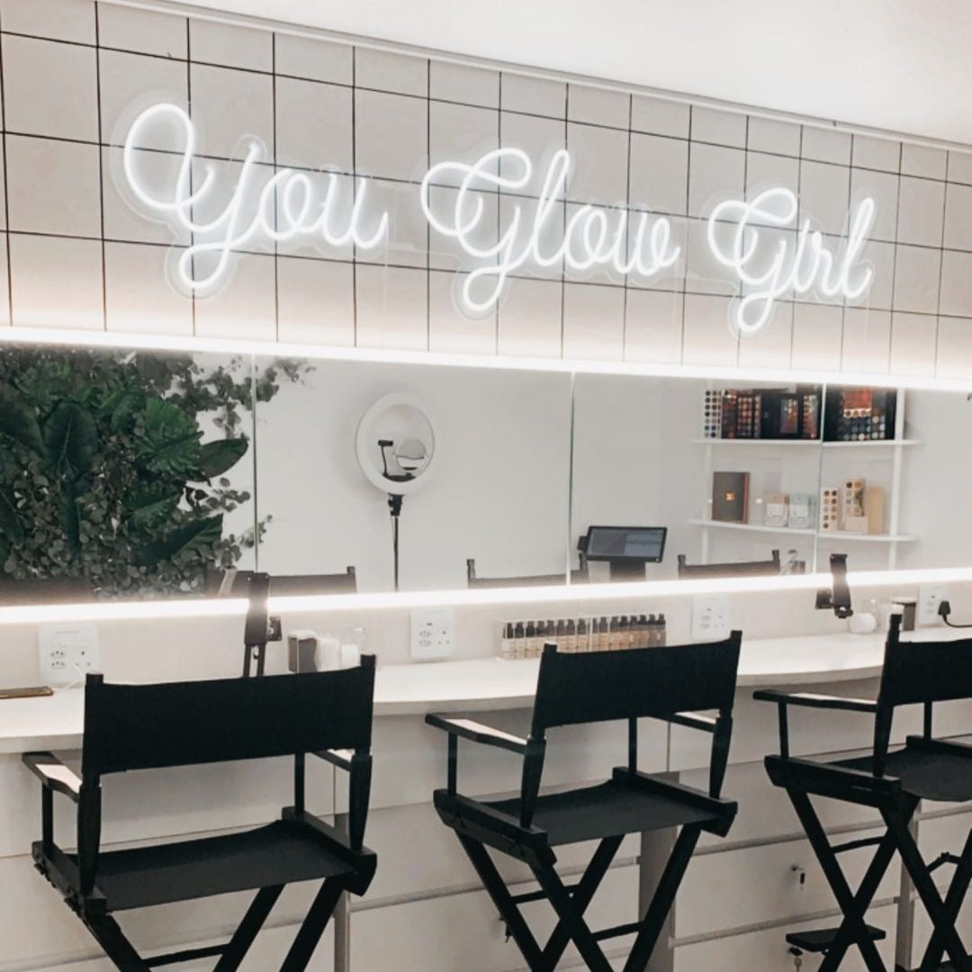 White custom neon sign reading “You Glow Girl” inside a Melbourne hairdresser salon.