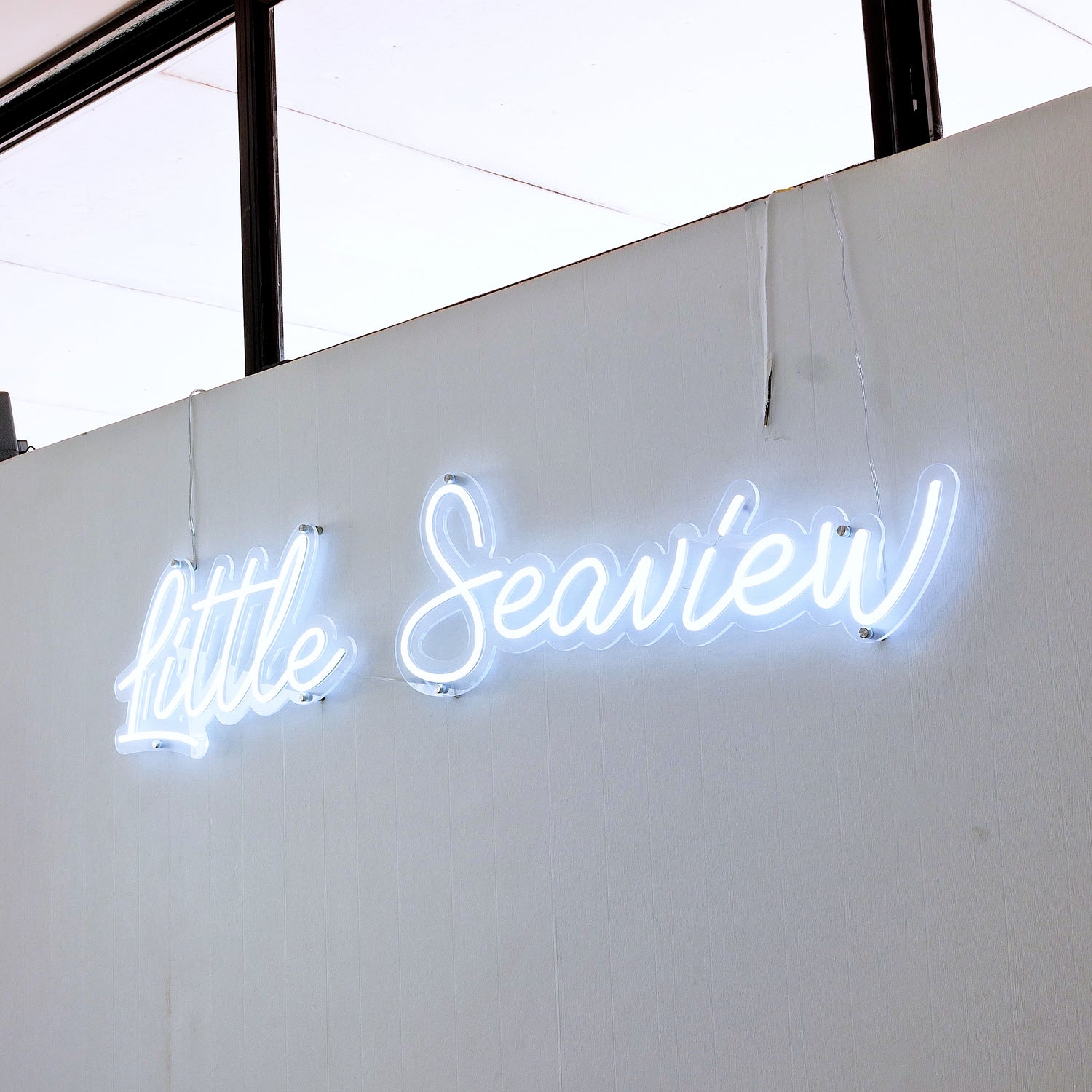 White Neon sign saying The little Seaview at Scarborough, Perth Sea front cafe