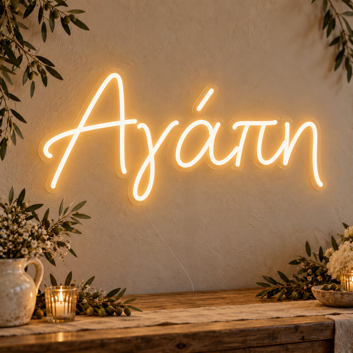 Agapi Greek Love Neon Sign on clear cut-to-shape acrylic, illuminated on a wall in a styled celebration setting