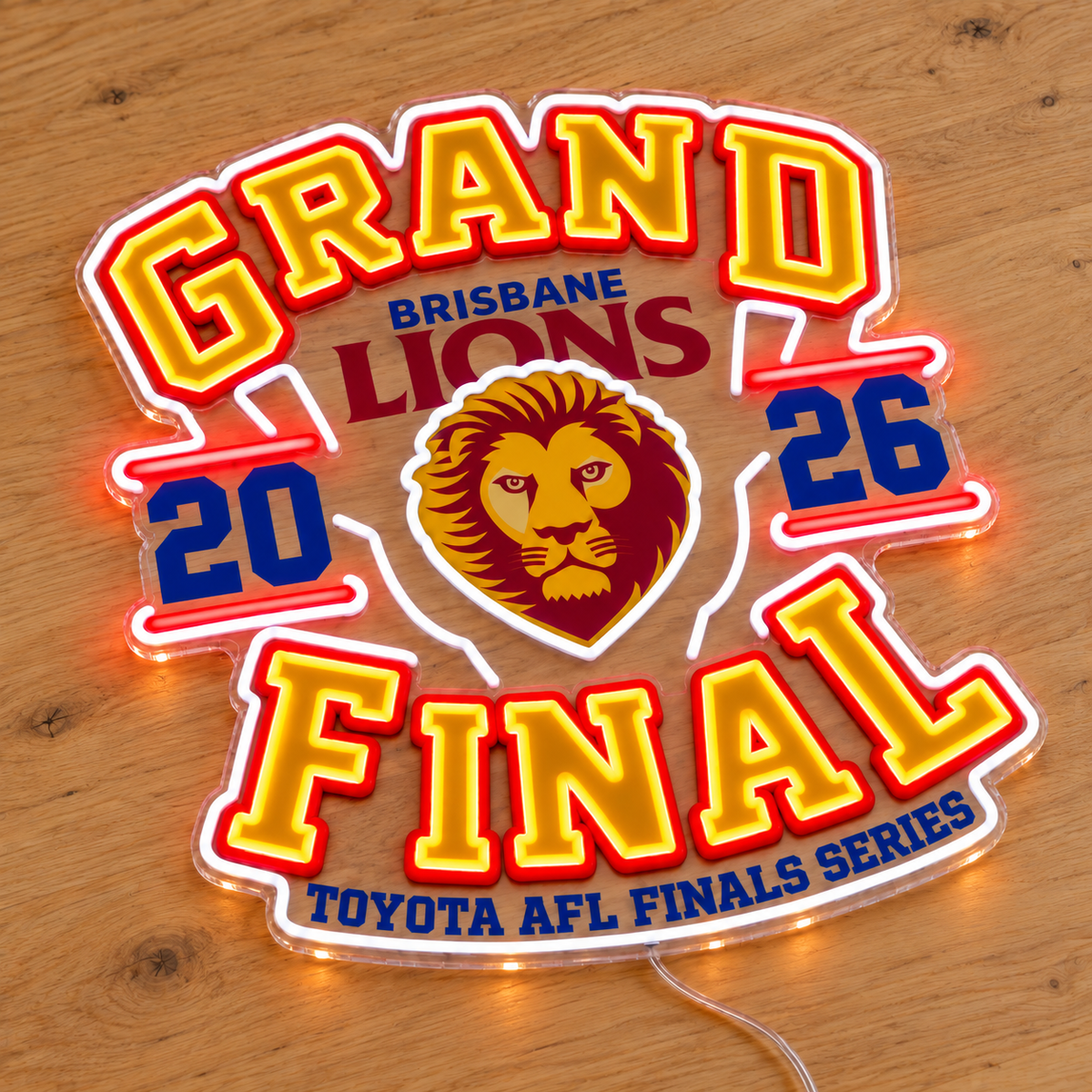 Brisbane Lions Grand Final Neon Sign on a wooden surface viewed from an angle
