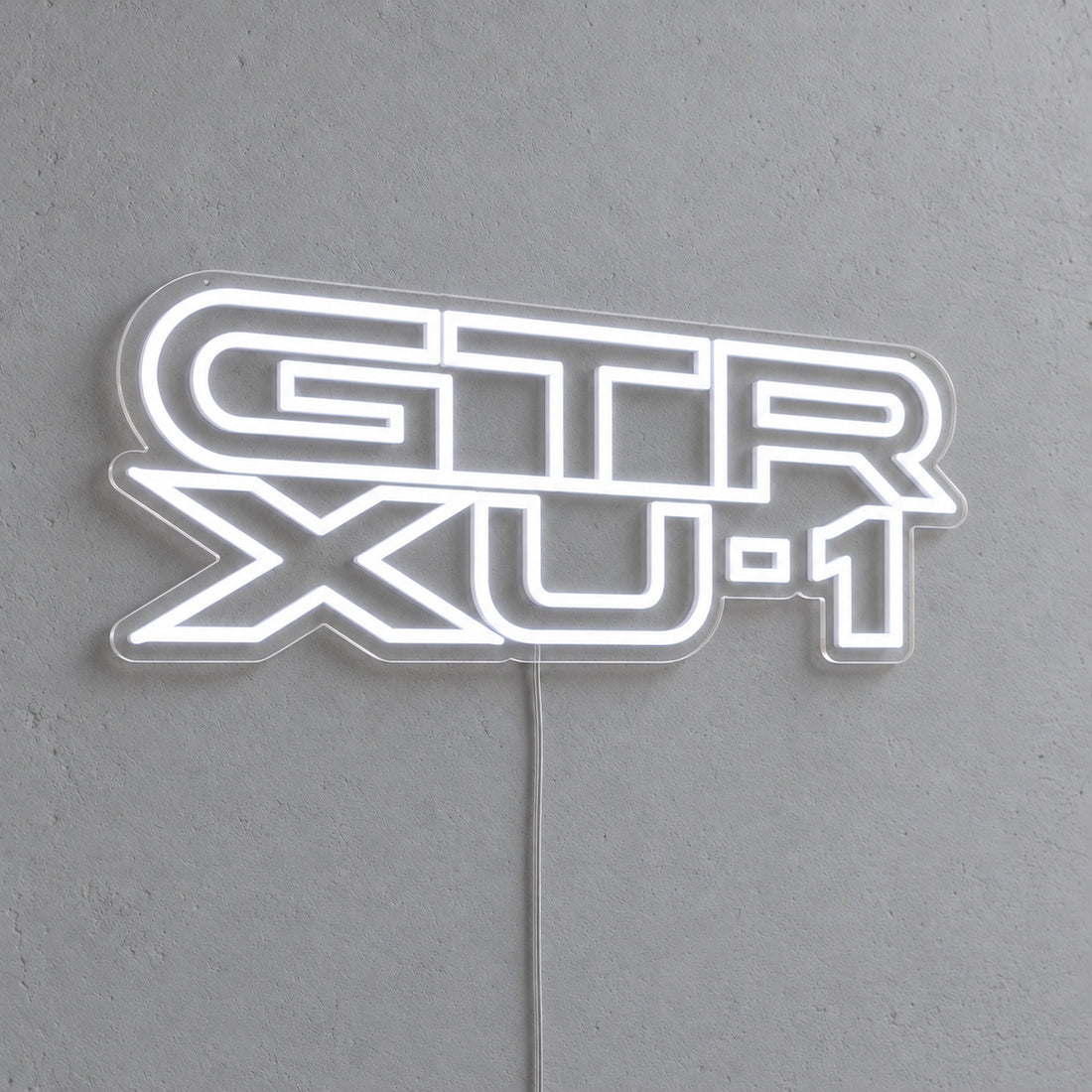 Holden Torana GTR-XU1 LED Neon Sign in white, featuring stacked GTR XU-1 lettering on a grey wall.