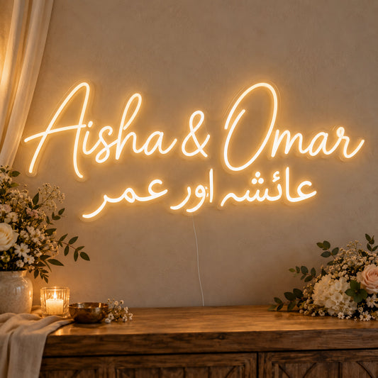 Personalised Two Script Names Neon Sign on clear cut-to-shape acrylic in an illuminated wall display; example personalisation shown.