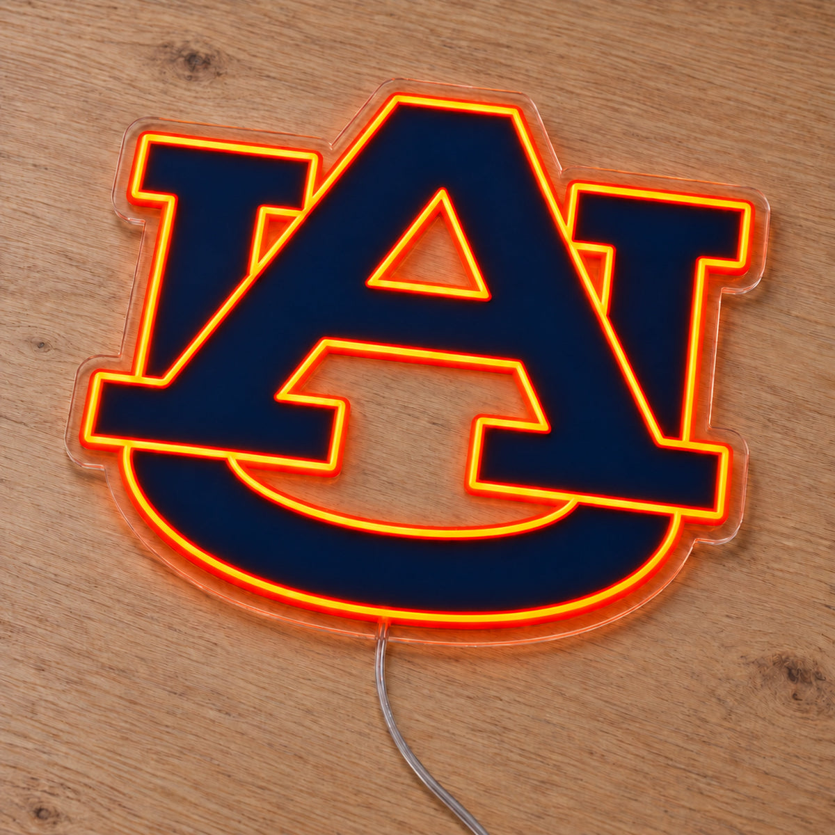 Auburn Tigers LED Neon Sign, featuring team logo displayed on a wooden surface.