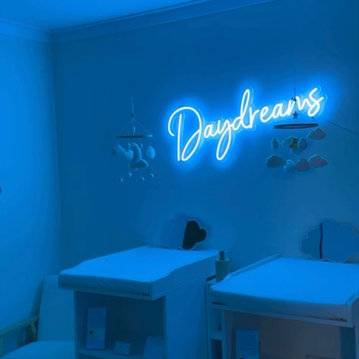 Blue Neon sign saying "daydreams" for infant massage in Perth
