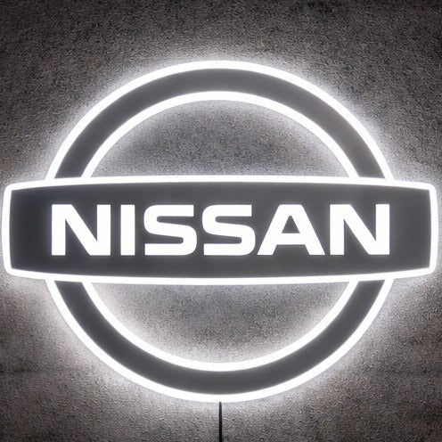 Nissan logo LED neon sign glowing in a workshop, bold JDM inspired wall feature
