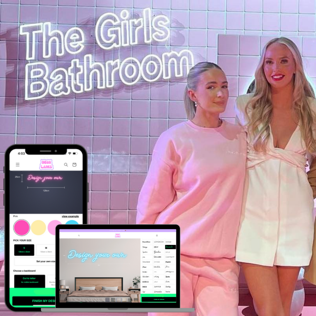 2 girls in the bar bathroom with a “the girls bathroom” LED Neon Sign light