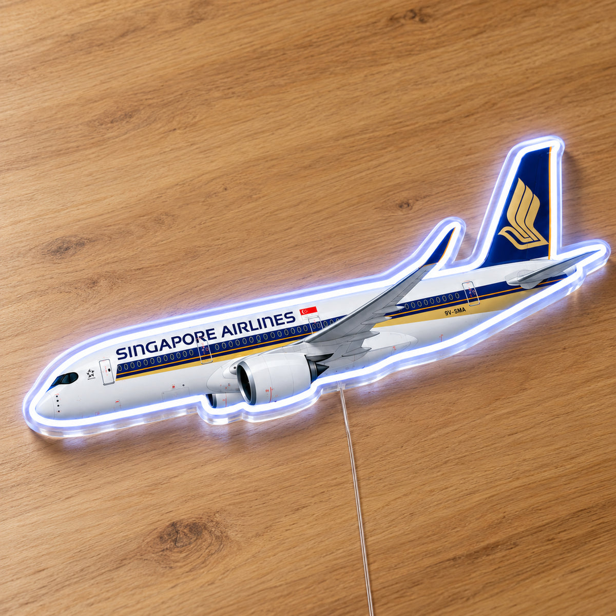 Airbus A350-900 Singapore Airlines Neon Sign with printed aircraft details and an illuminated LED outline on clear acrylic, shown on a wooden surface, registration 9V-SMA