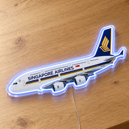 Airbus A380 Singapore Airlines Neon Sign with printed aircraft details and an illuminated LED outline on clear acrylic, shown on a wooden surface, registration 9V-SKZ