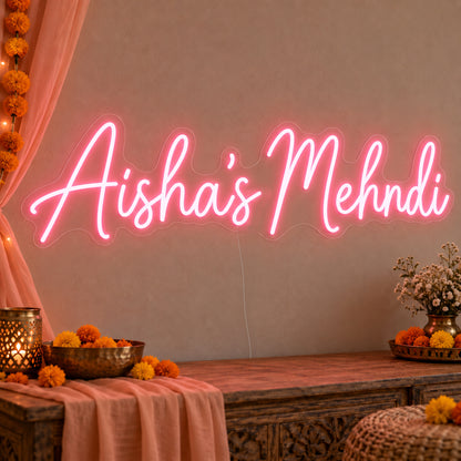 Personalised Mehndi Neon Sign on clear cut-to-shape acrylic, illuminated on a wall in a styled celebration setting; sample personalised wording shown