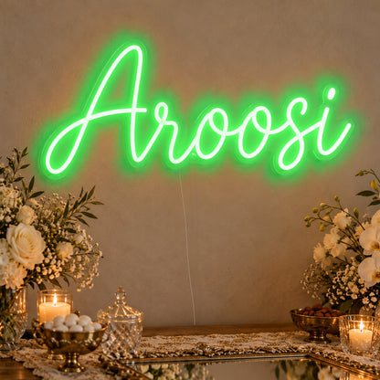Aroosi Neon Sign in green LED neon on clear acrylic, angled view