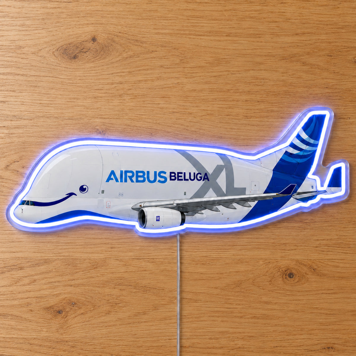 Airbus Beluga XL Neon Sign with printed aircraft details and an illuminated LED outline on clear acrylic, shown on a wooden surface