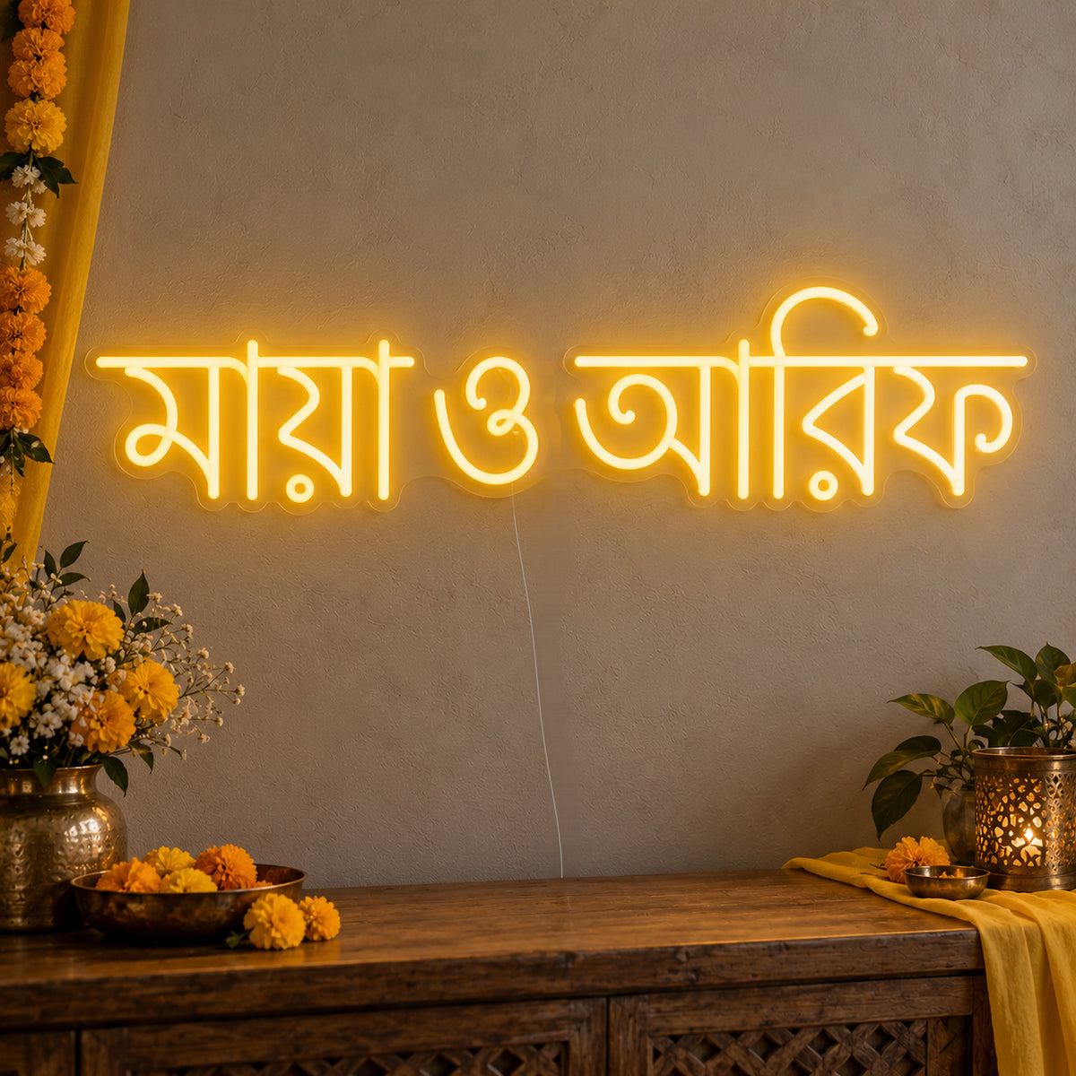 Personalised Bengali Couple Names Neon Sign on clear cut-to-shape acrylic in an illuminated wall display; example personalisation shown.
