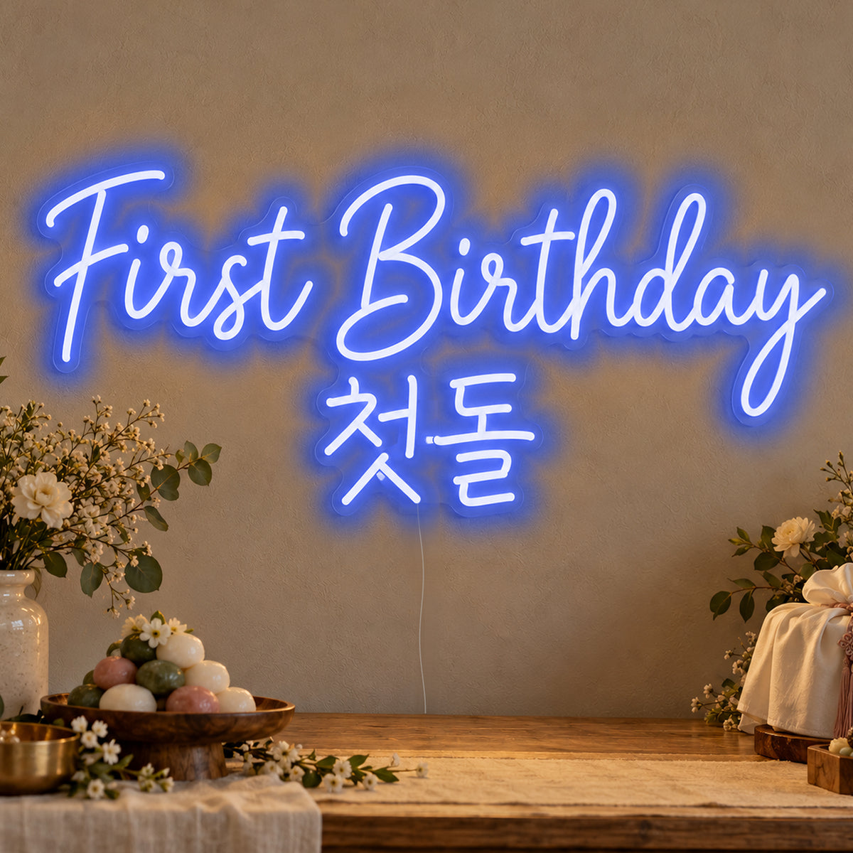 First Birthday English & Korean Neon Sign in blue LED neon on clear acrylic, angled view