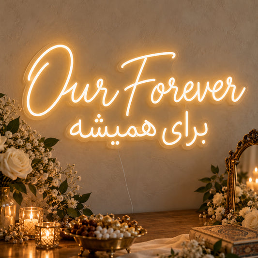 Our Forever English & Persian Neon Sign on clear cut-to-shape acrylic, illuminated on a wall in a styled celebration setting
