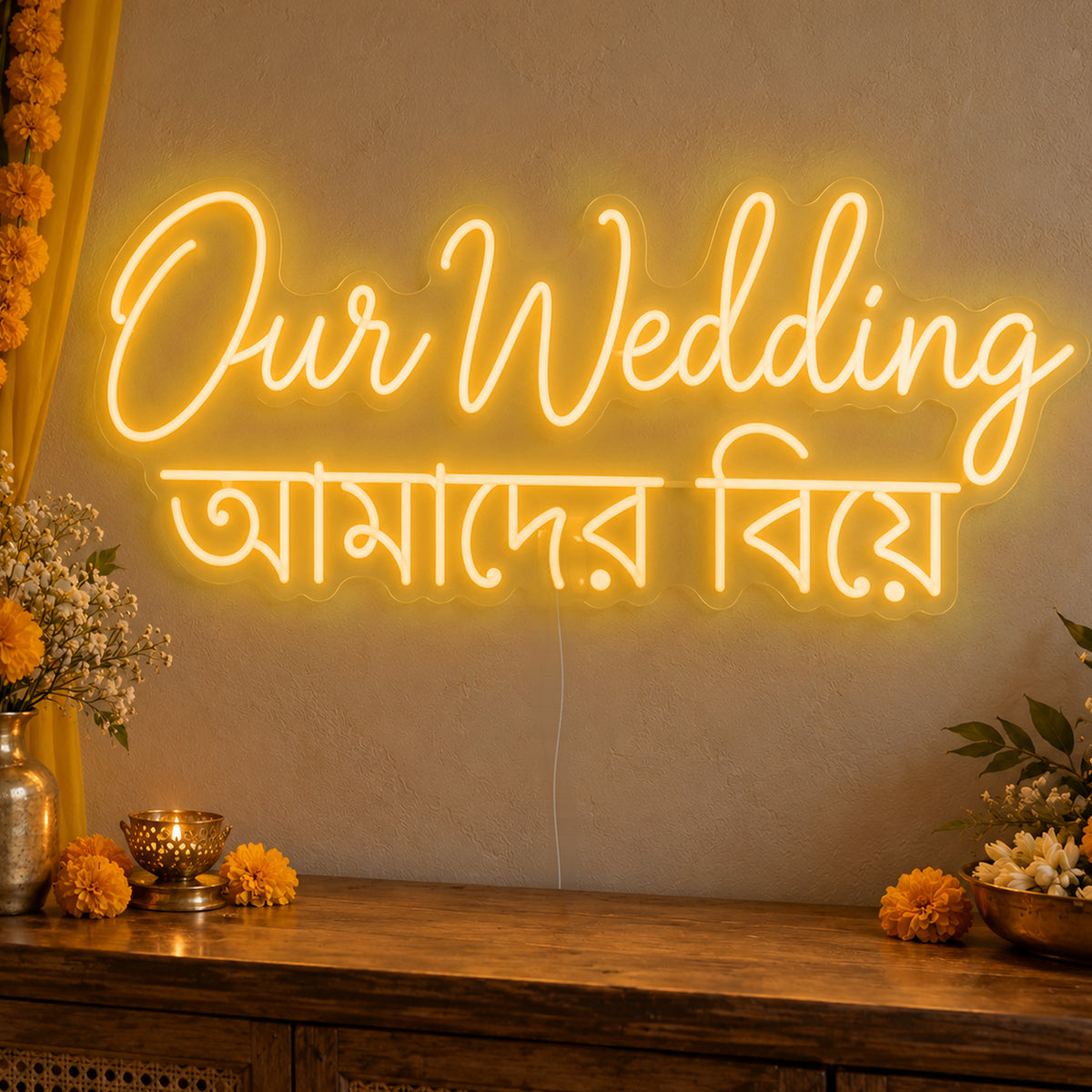 Our Wedding English & Bengali Neon Sign in gold LED neon on clear acrylic, angled view