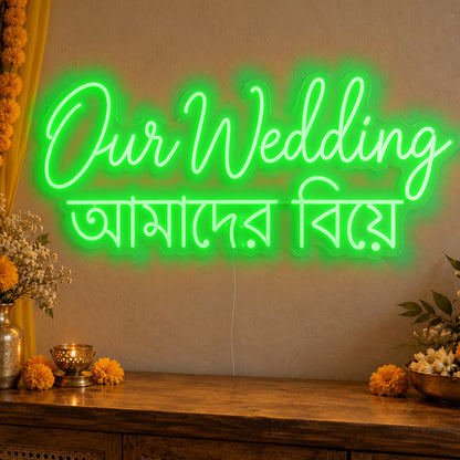 Our Wedding English & Bengali Neon Sign in green LED neon on clear acrylic, angled view