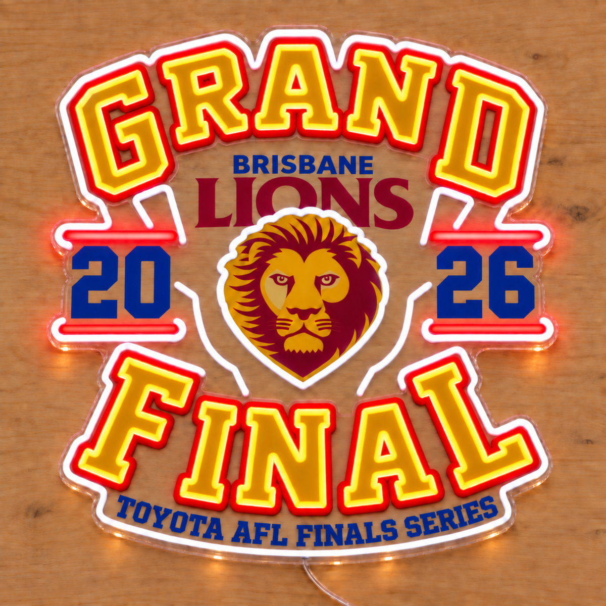 Brisbane Lions Grand Final Neon Sign glowing on a wooden surface
