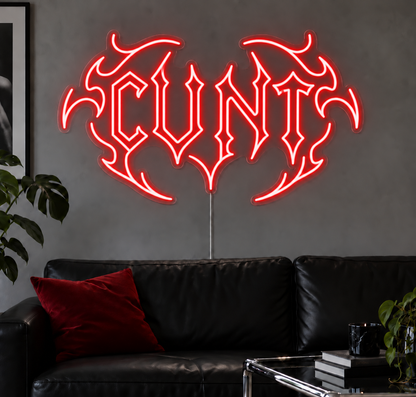 Cunt Neon Sign in Red LED neon with double outlined C, displayed above a black leather sofa.