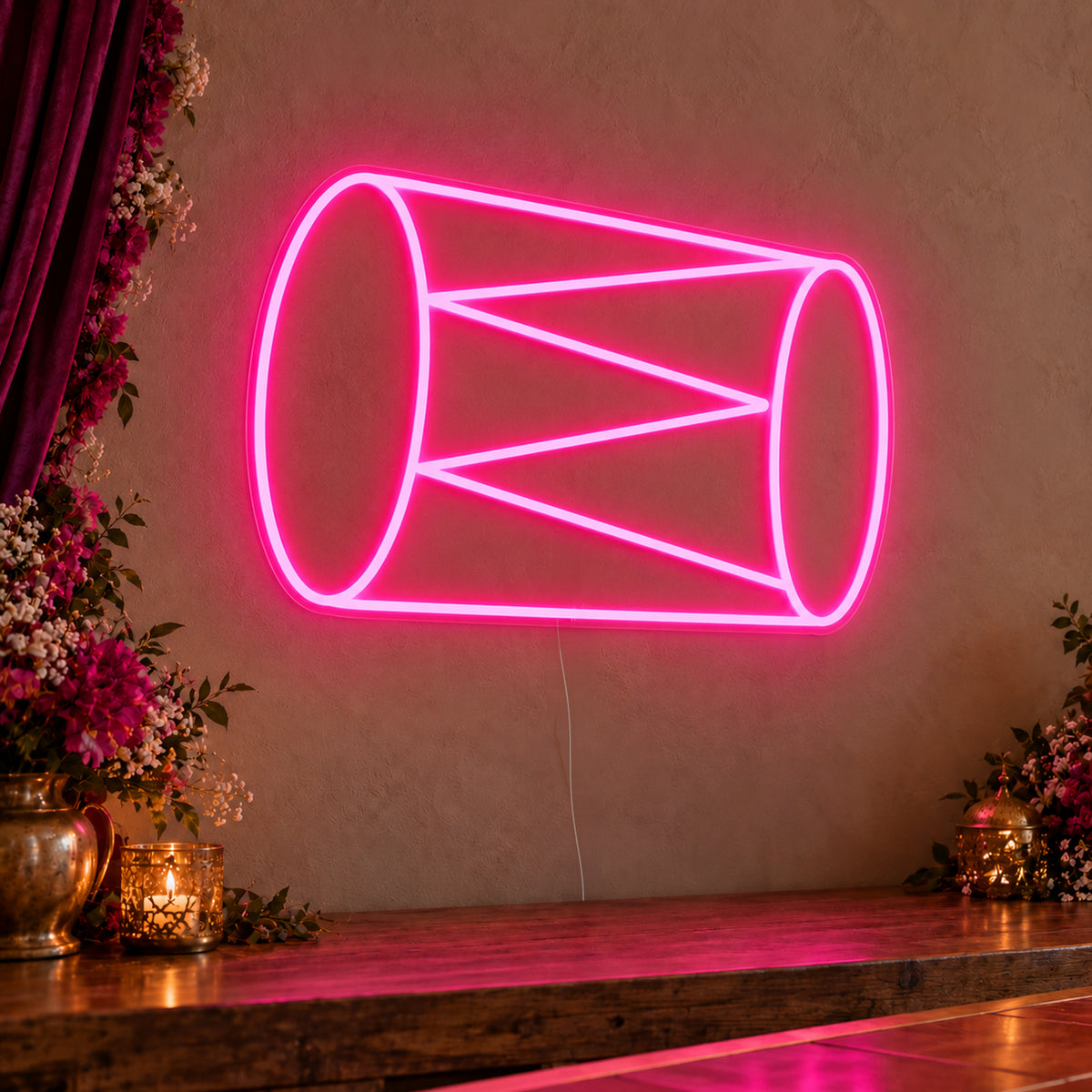 Dhol Drum Neon Sign on clear cut-to-shape acrylic, illuminated on a wall in a styled celebration setting