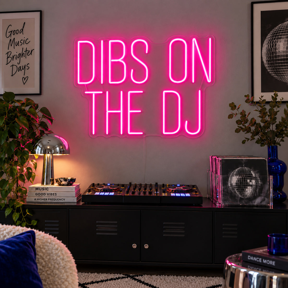 Rose Red version of the Dibs On The DJ Neon Sign, shown above a home DJ setup.