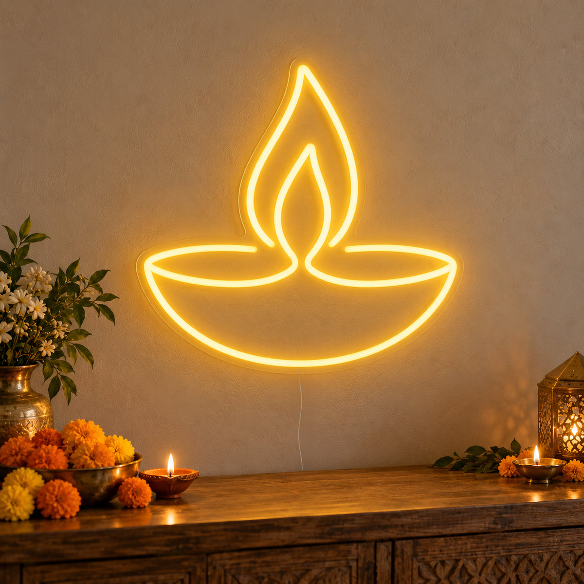 Diya Lamp Neon Sign on clear cut-to-shape acrylic, illuminated on a wall in a styled celebration setting