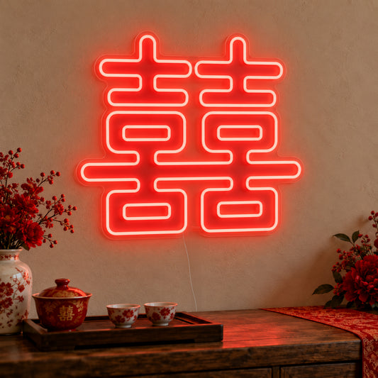 Double Happiness Red Neon Sign on clear cut-to-shape acrylic, illuminated on a wall in a styled celebration setting