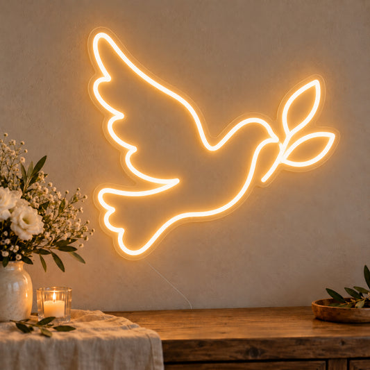 Dove Neon Sign on clear cut-to-shape acrylic, illuminated on a wall in a styled celebration setting