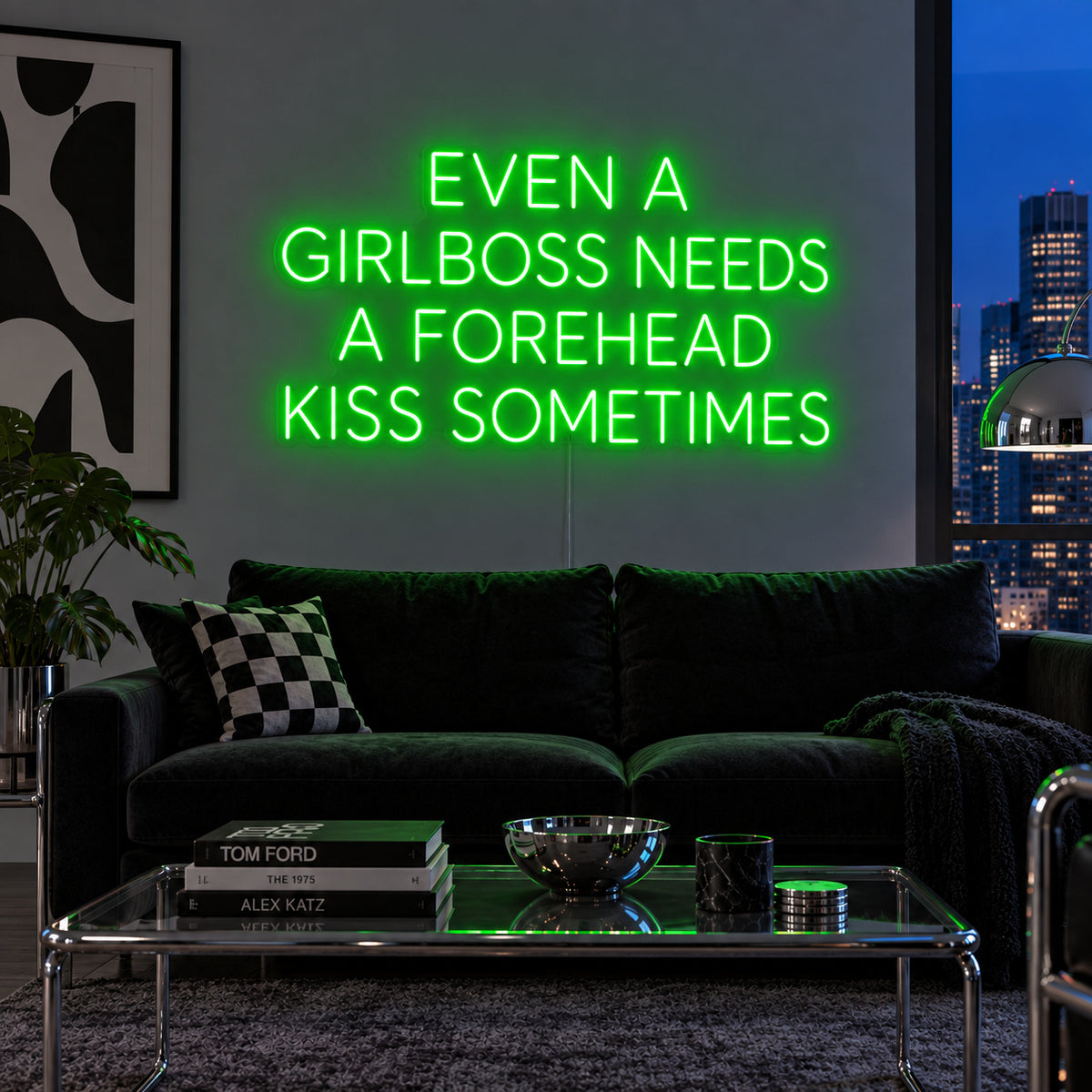 Even A Girlboss Needs A Forehead Kiss Sometimes Neon Sign with green lighting, displayed above a dark sofa and mirrored coffee table.
