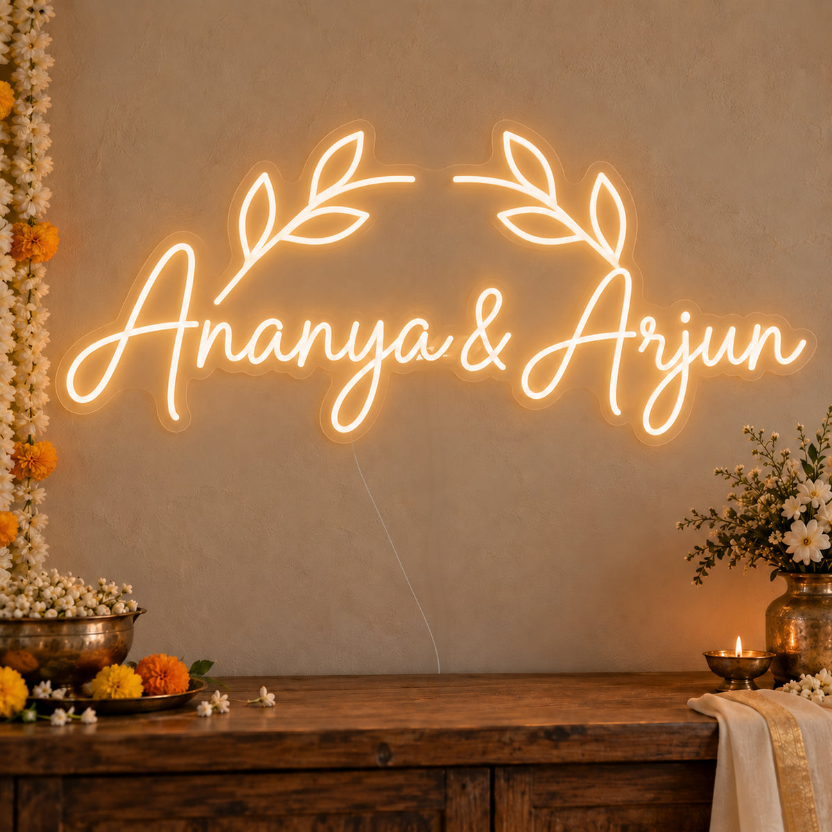 Personalised Floral Arch Names Neon Sign on clear cut-to-shape acrylic in an illuminated wall display; example personalisation shown.