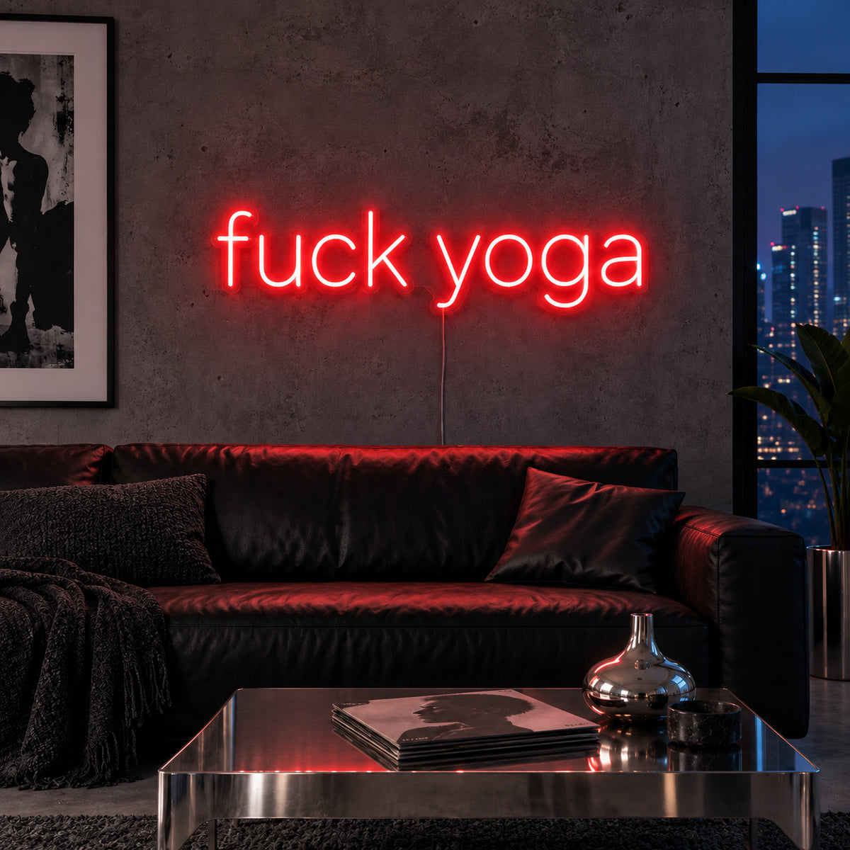 Fuck Yoga Neon Sign with red lighting, displayed above a black leather sofa.