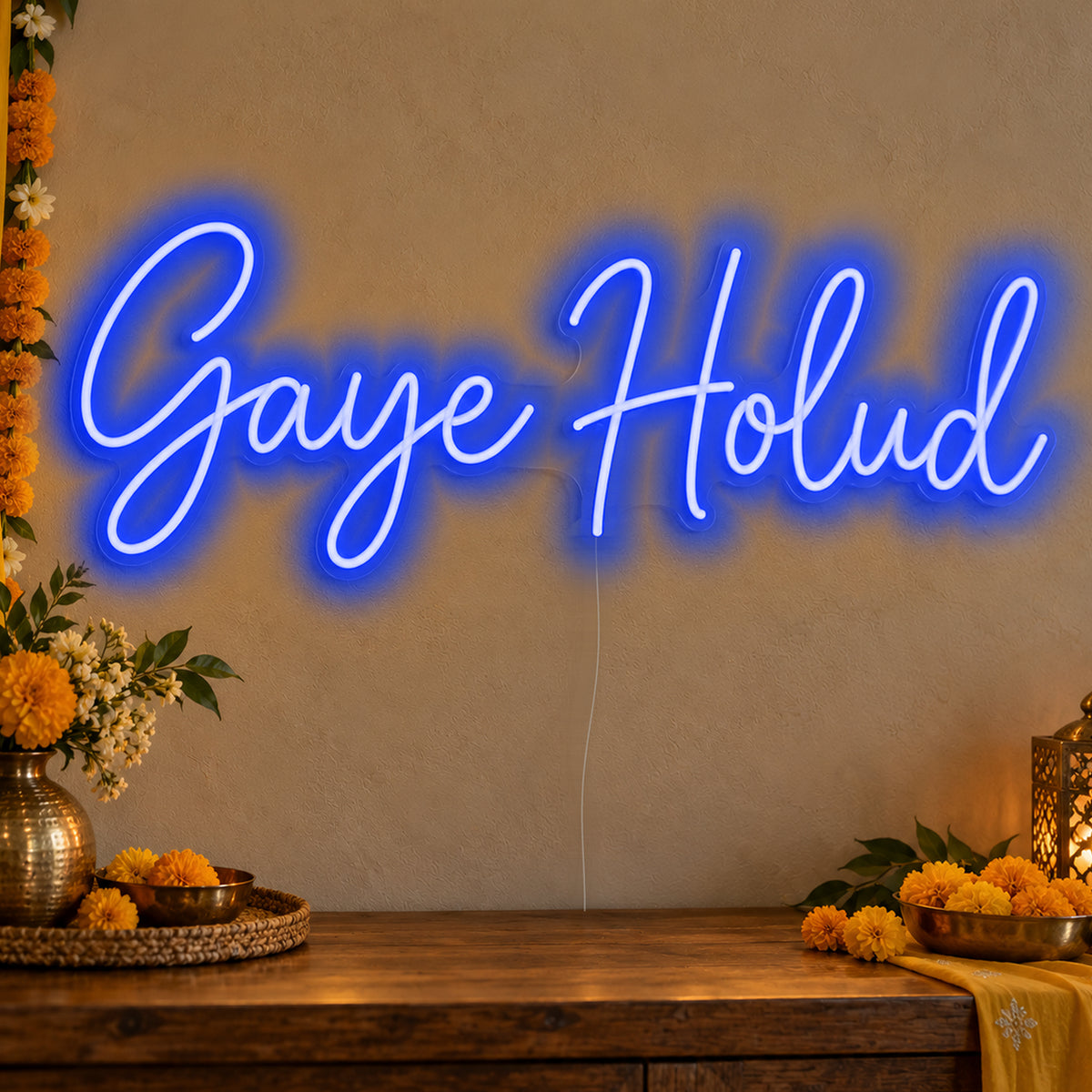 Gaye Holud Neon Sign in blue LED neon on clear acrylic, angled view