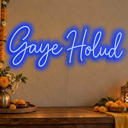 Gaye Holud Neon Sign in blue LED neon on clear acrylic, angled view