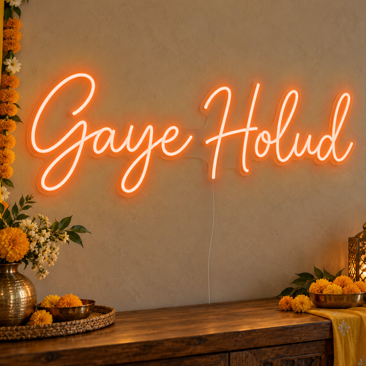 Gaye Holud Neon Sign in orange LED neon on clear acrylic, angled view