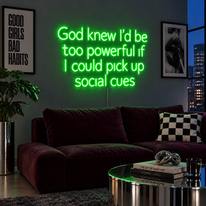 God Knew I'd Be Too Powerful If I Could Pick Up Social Cues Neon Sign with green lighting, displayed above a burgundy sofa.