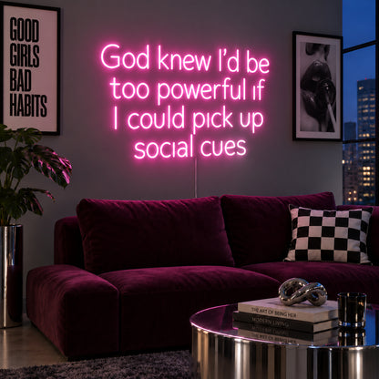 God Knew I'd Be Too Powerful If I Could Pick Up Social Cues Neon Sign glowing pink above a burgundy sofa.