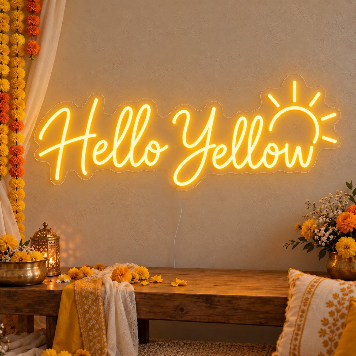 Hello Yellow Neon Sign on clear cut-to-shape acrylic, illuminated on a wall in a styled celebration setting