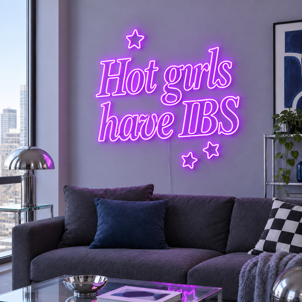 Hot Girls Have IBS Neon Sign with purple lighting, displayed with star details above a charcoal sofa.