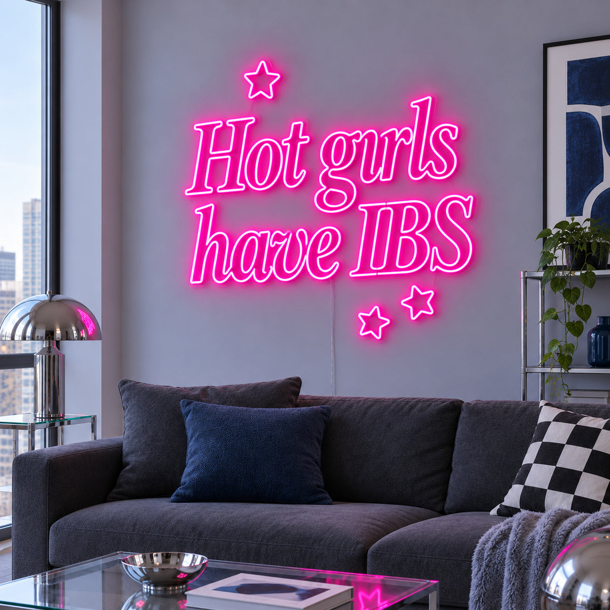 Rose Red version of the Hot Girls Have IBS Neon Sign, shown with star details above a charcoal sofa.