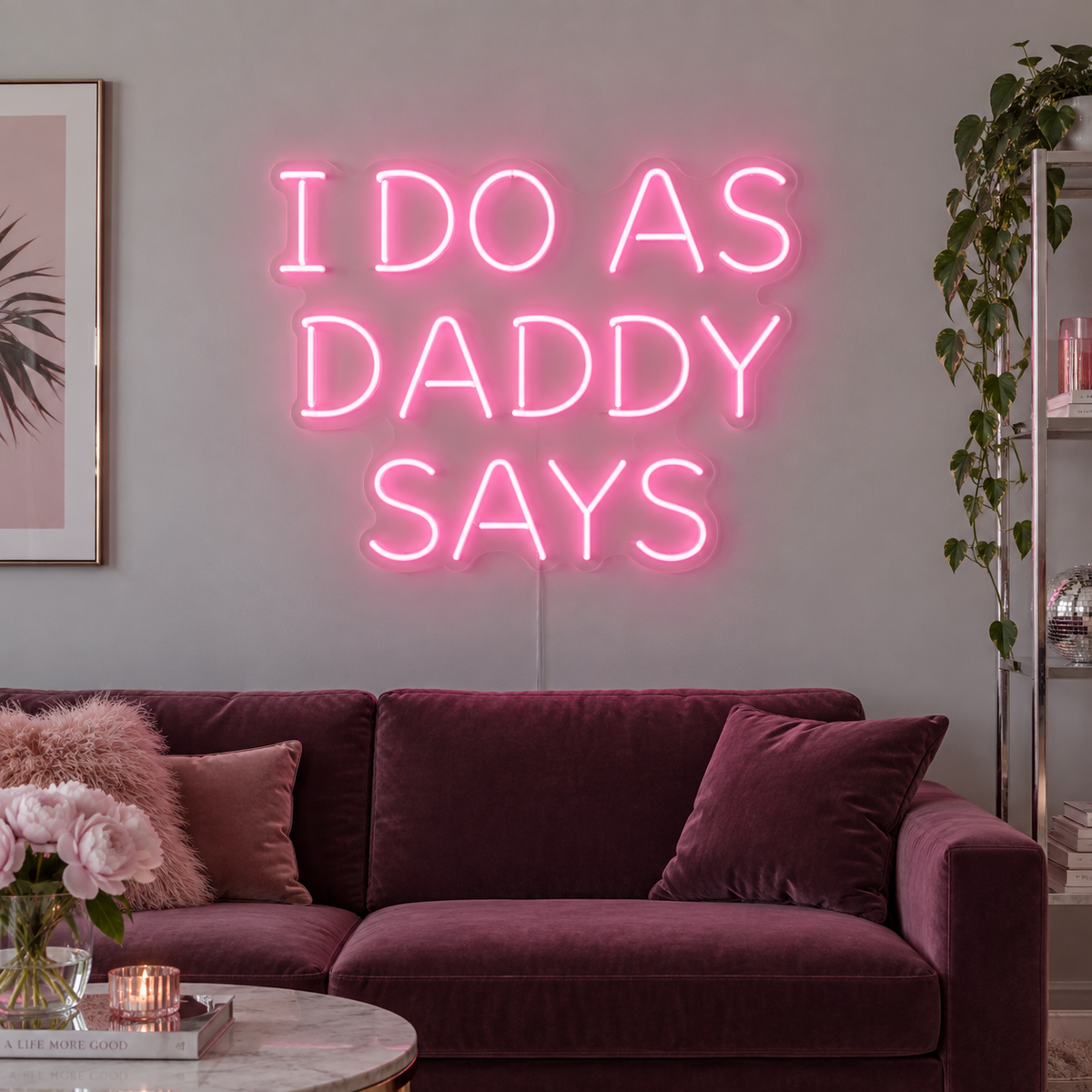 I Do As Daddy Says Neon Sign in pink above a burgundy sofa.