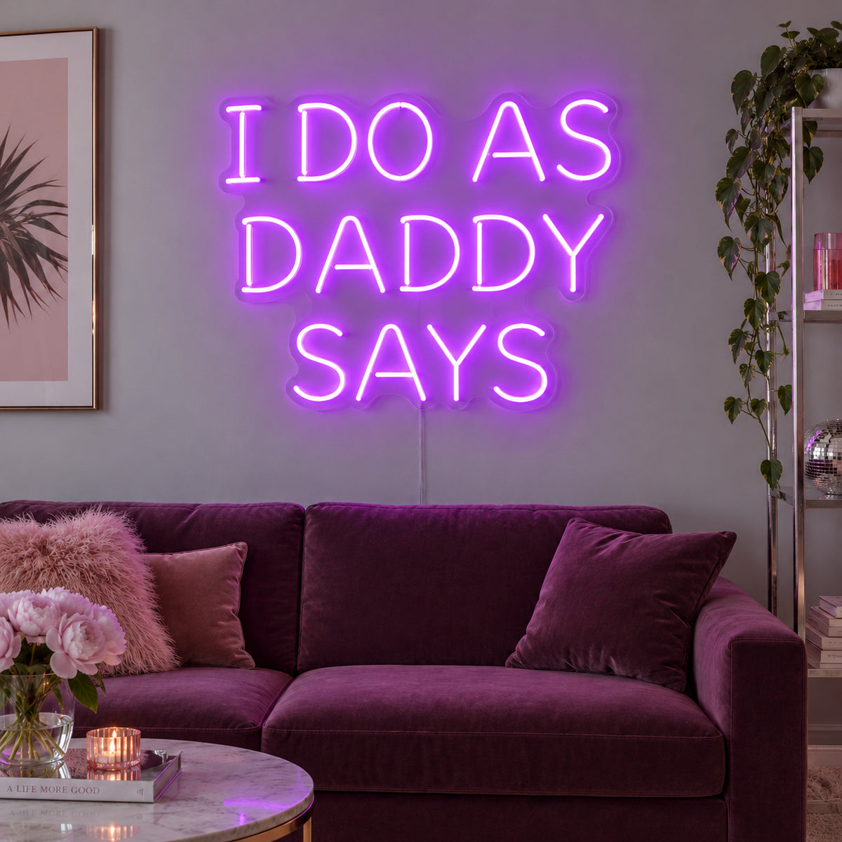 I Do As Daddy Says Neon Sign with purple lighting, displayed above a burgundy sofa.