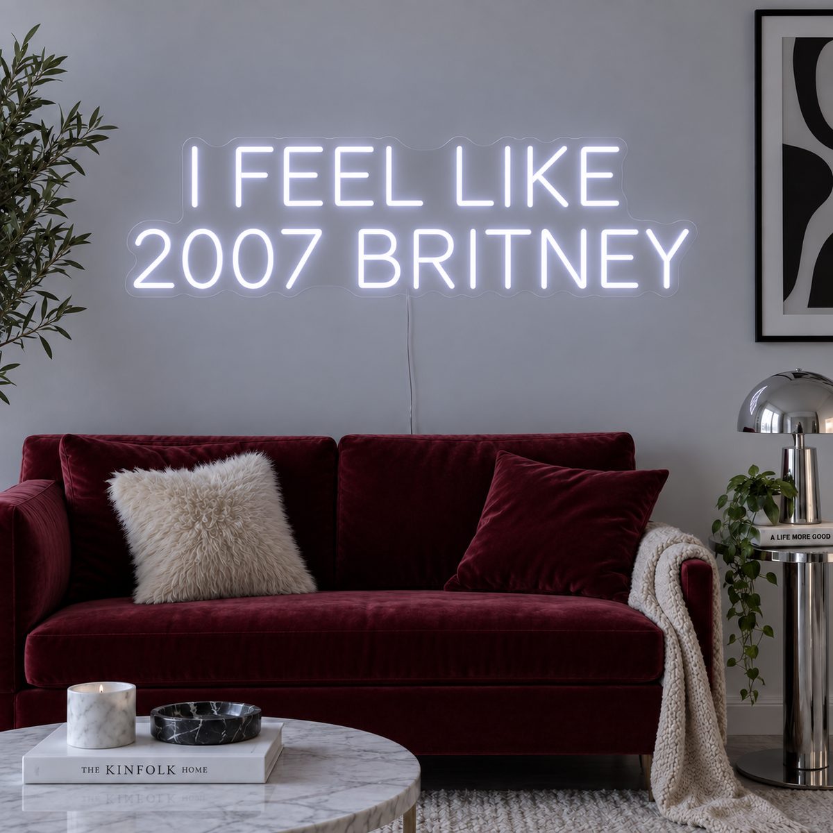 I Feel Like 2007 Britney Neon Sign, RGB colour-changing option shown in white above a burgundy sofa.