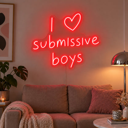 I Love Submissive Boys Neon Sign with red lighting, displayed above a neutral sofa.