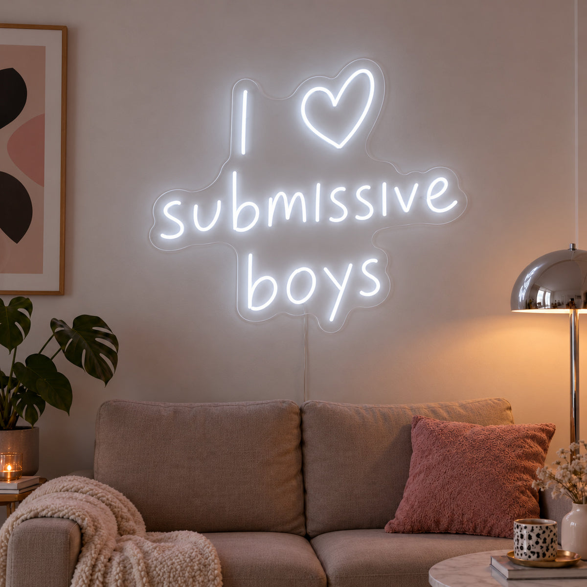 I Love Submissive Boys Neon Sign, RGB colour-changing option shown in white above a neutral sofa.