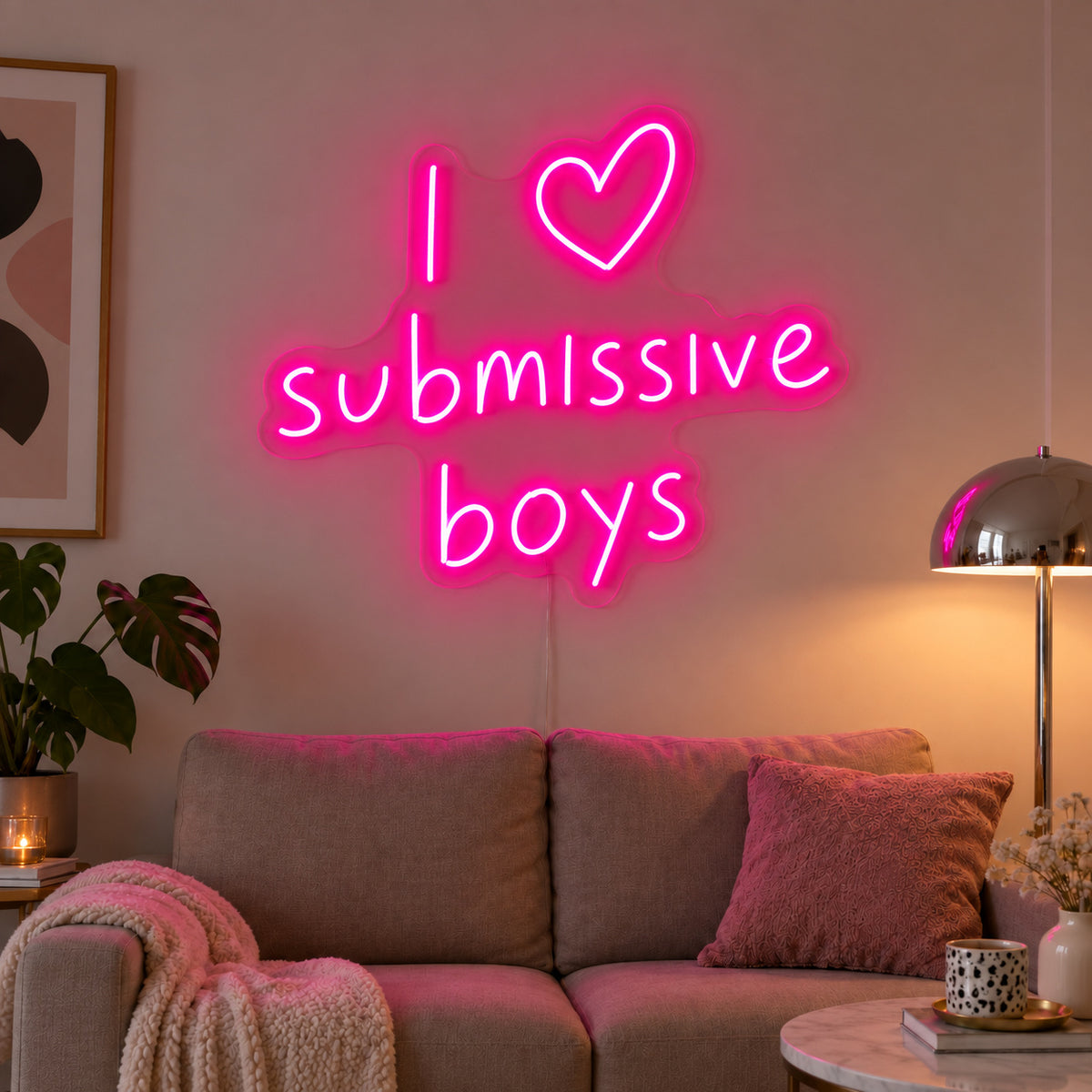 Rose Red version of the I Love Submissive Boys Neon Sign, shown above a neutral sofa.