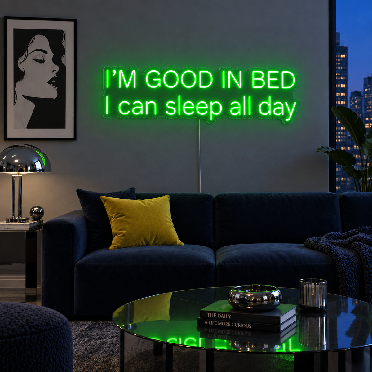 I'm Good In Bed I Can Sleep All Day Neon Sign with green lighting, displayed above a navy sofa.