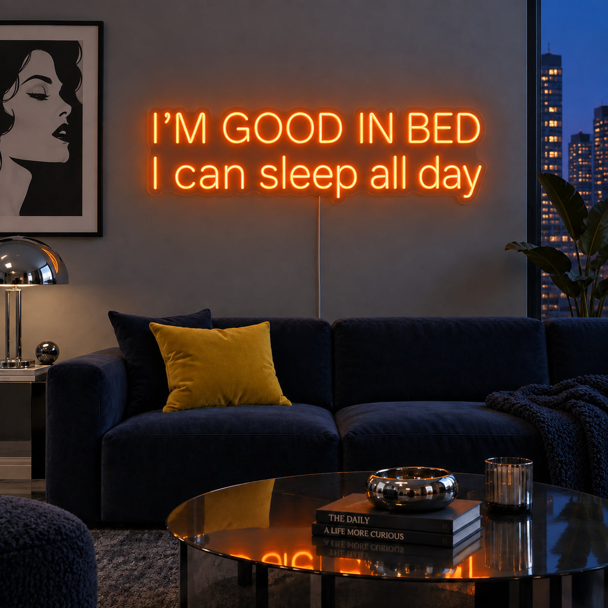 Orange version of the I'm Good In Bed I Can Sleep All Day Neon Sign, shown above a navy sofa.