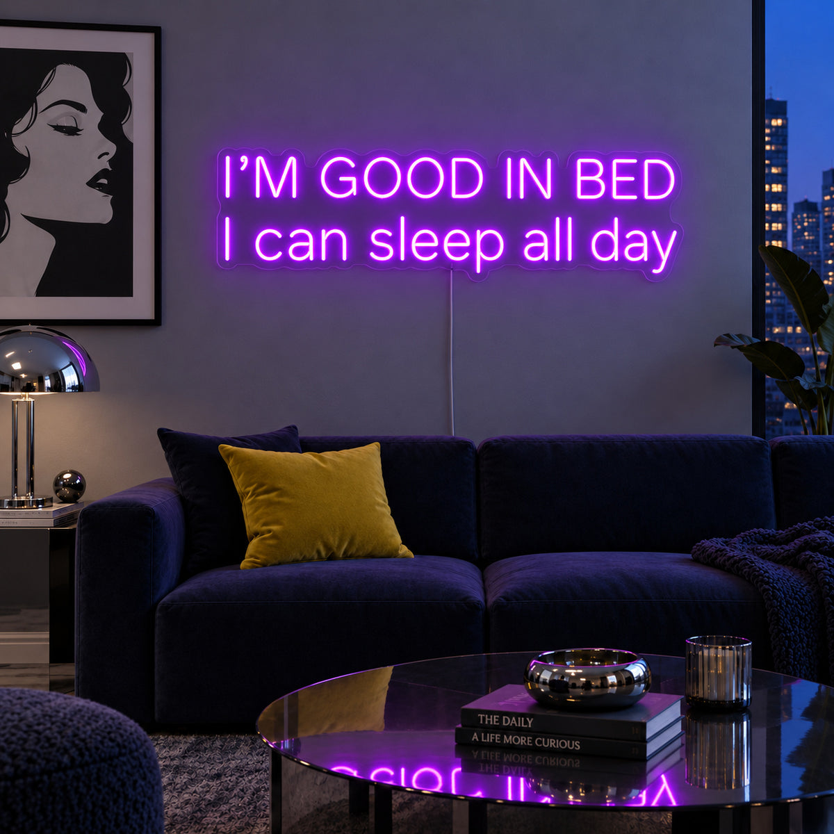 I'm Good In Bed I Can Sleep All Day Neon Sign with purple lighting, displayed above a navy sofa.