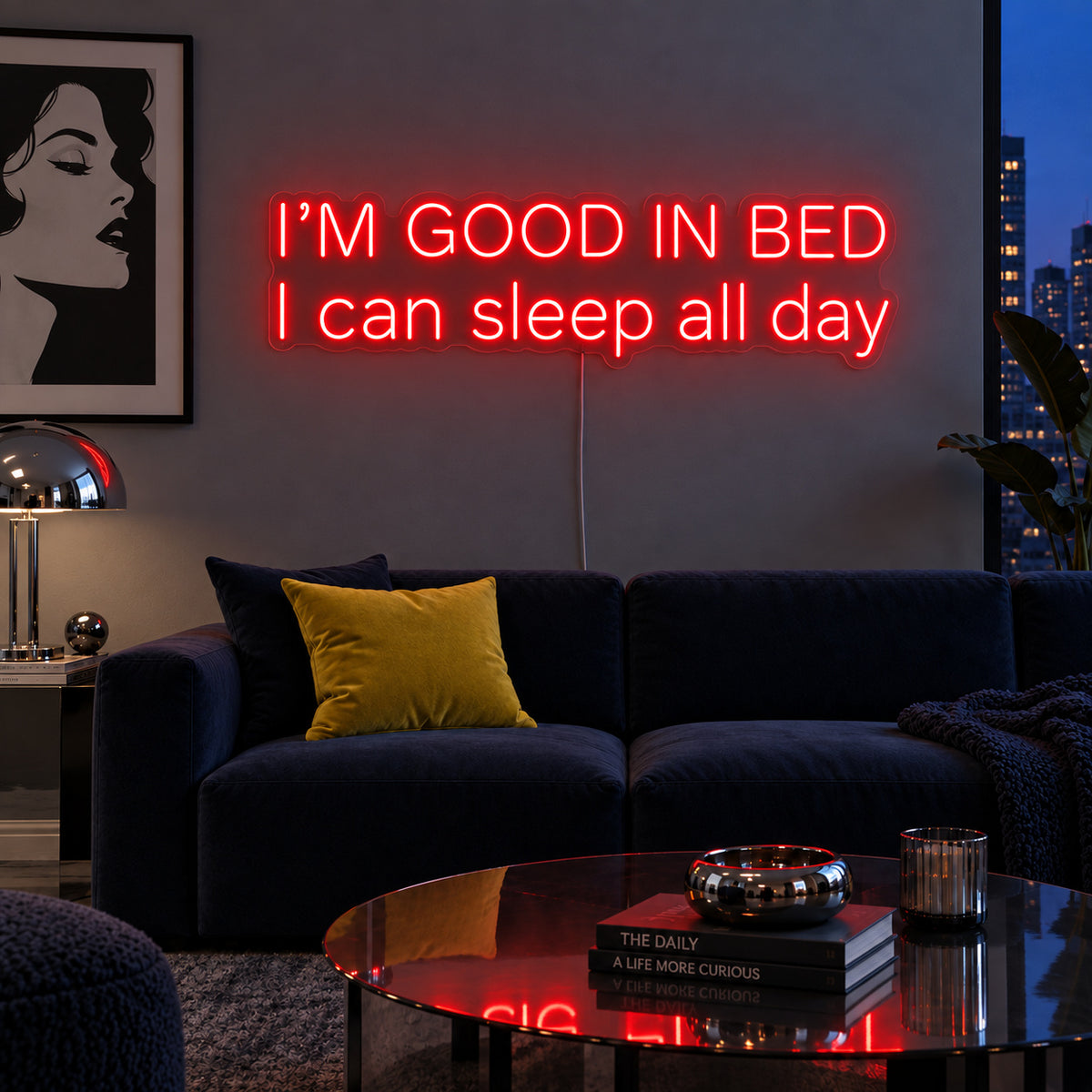 I'm Good In Bed I Can Sleep All Day Neon Sign with red lighting, displayed above a navy sofa.