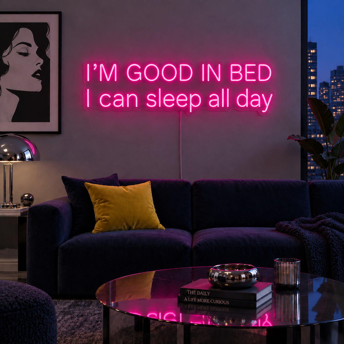 Rose Red version of the I'm Good In Bed I Can Sleep All Day Neon Sign, shown above a navy sofa.
