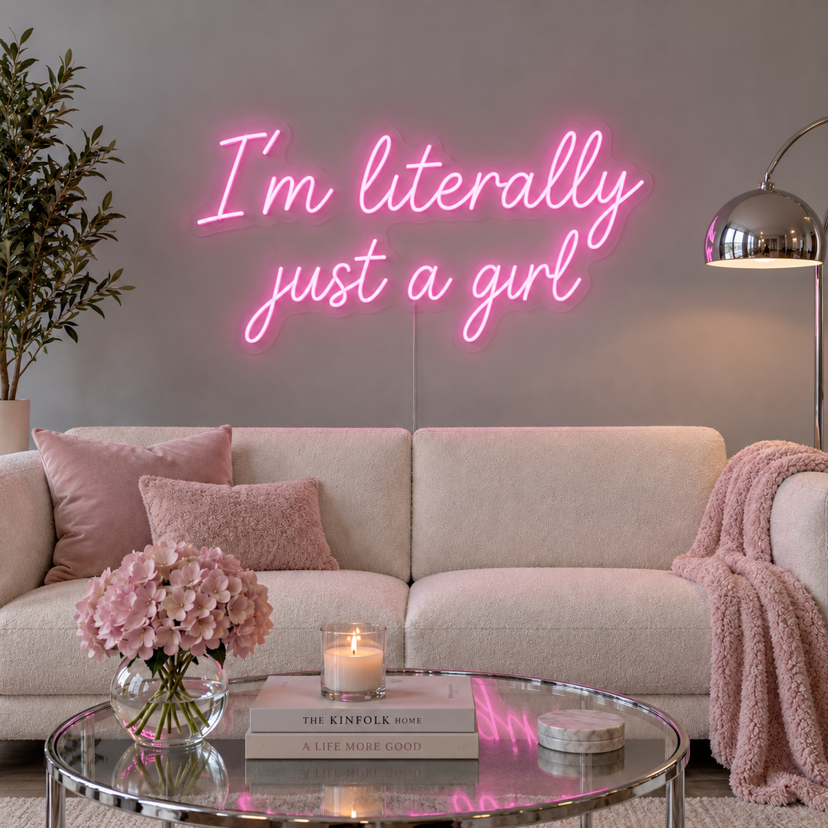 I'm Literally Just A Girl Neon Sign in pink above a cream sofa.